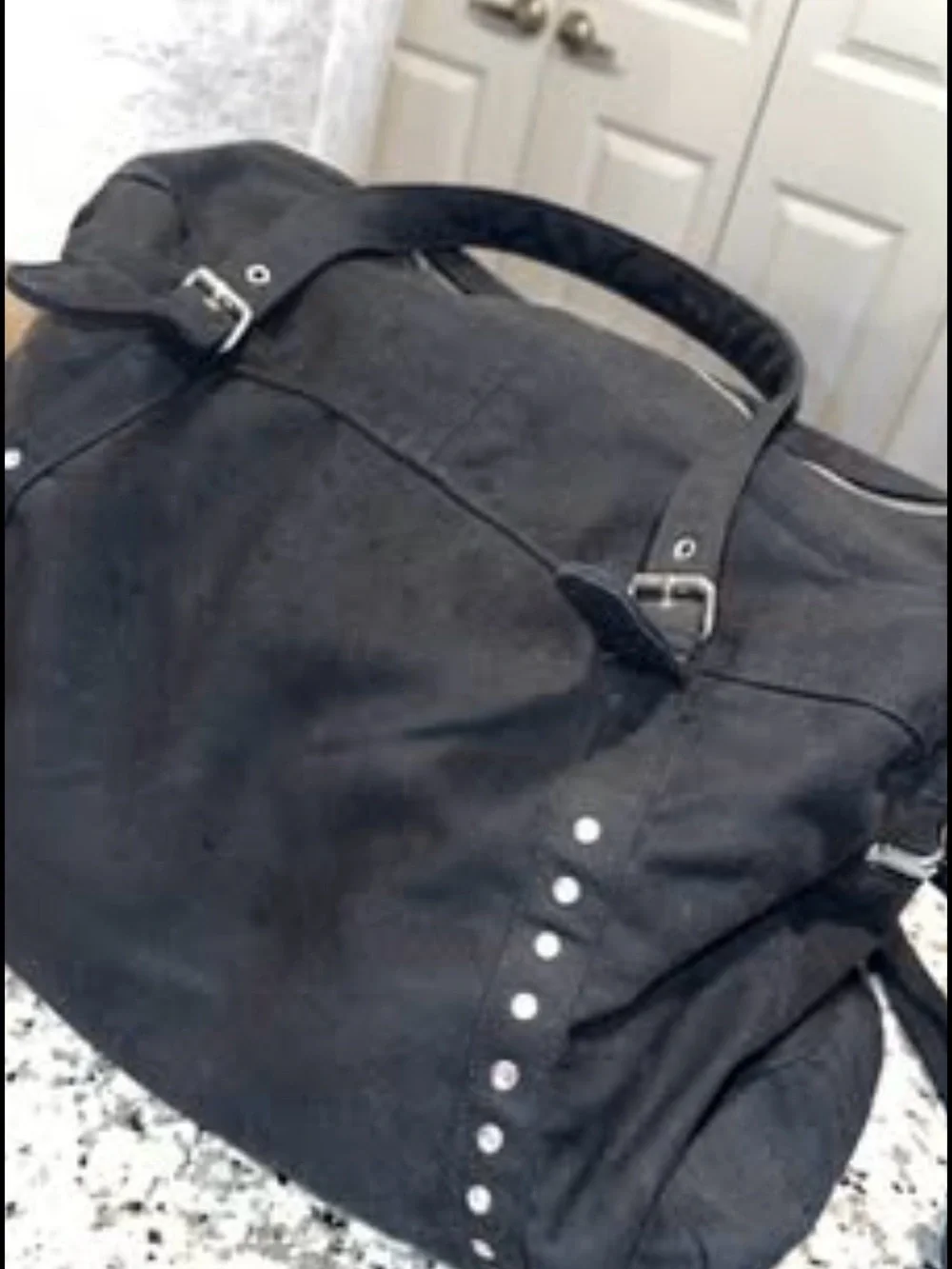Black Stud-Accent woman’s Travel Duffel Bag